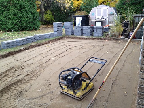 Step 2: Apply concrete sand. Level and tamp.